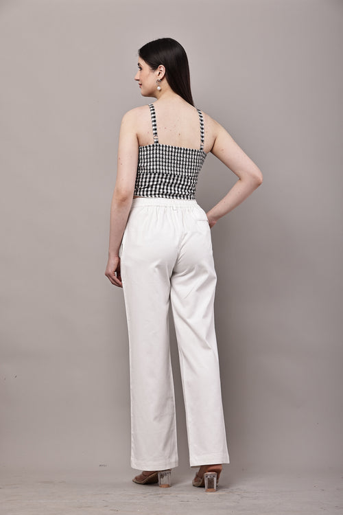 Back view of black and white gingham co-ord set for women with bustier crop top and white wide leg trousers