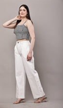 Side view of black and white gingham co-ord set for women with bustier crop top and white wide leg trouser.