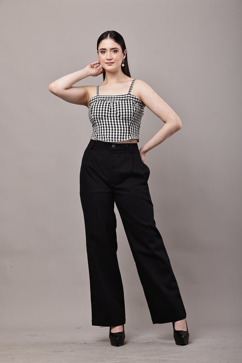 Front view of black and white gingham co-ord set for women with bustier crop top and high waist wide leg trousers