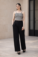 Black and white gingham co-ord set for women with bustier crop top and high waist wide leg trousers in outdoor setting