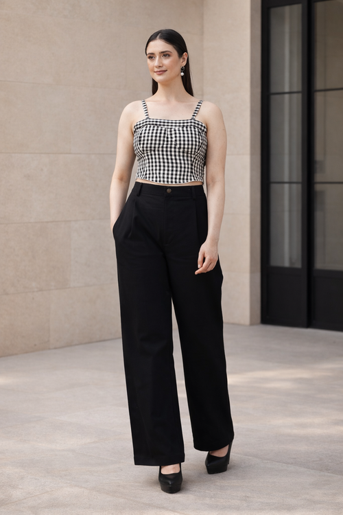 Black and white gingham co-ord set for women with bustier crop top and high waist wide leg trousers in outdoor setting