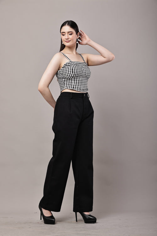 Side view of black and white gingham co-ord set for women with bustier crop top and high waist wide leg trousers