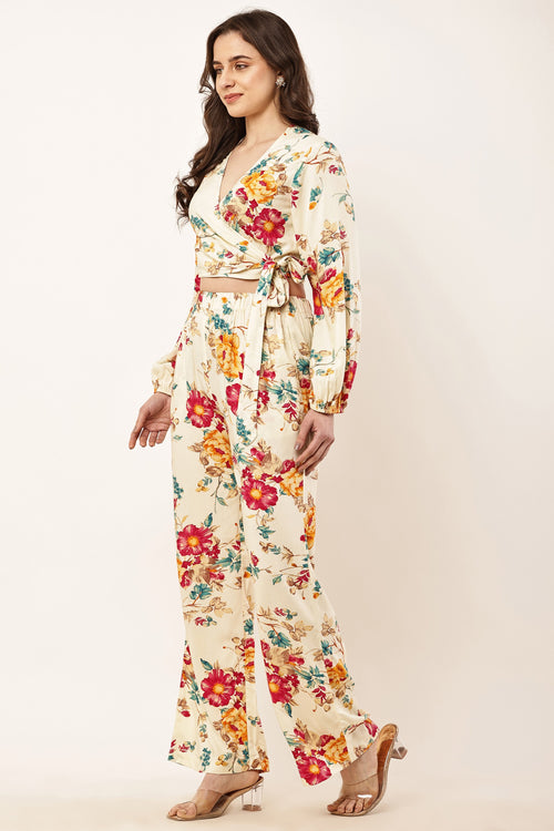 Woman wearing a floral outfit on a plain background